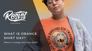 Women wearing an indigenous designed orange shirt from Resist Clothing Company